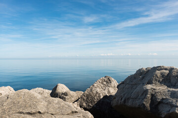view of the lake with rocks in the foreground