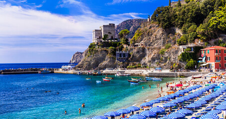 Italian summer holidays - Monterosso al Mare . view of beach and castle above, national park Cinque...