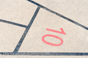 old shuffleboard court layout with markings outdoors