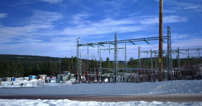 Timelapse of a Switchgear in Sweden. Moving clouds on a Cold Sunny Winter Day.