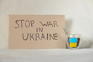 Stop the war in Ukraine written on a sign from a house in Ukraine, protest action, martial law