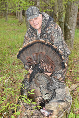A hunter with a turkey gobbler