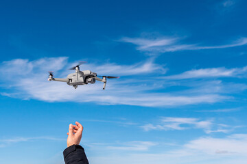 the drone takes off from the hands of the operator 