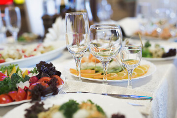 Served wedding banquet table with dishes in the restaurant