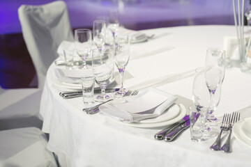 Beautiful setting of the wedding banquet table in the restaurant.