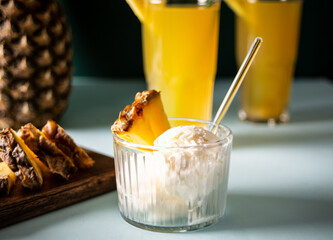 Delicious pineapple ice cream sorbet sundae. Summer food concept.