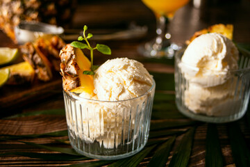 Delicious pineapple ice cream sorbet sundae. Summer food concept. - obrazy, fototapety, plakaty