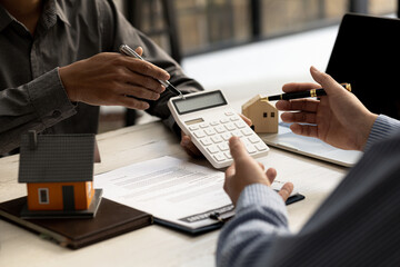 A rental company employee is calculating the cost for the customer to agree to sign a rental...
