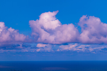The storm clouds are approach over the blue sky
