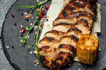 Ketogenic diet food, grilled chicken fillet. Barbecued chicken breasts on slate plate, Roasted Chicken fillet with vegetables, healthy meal concept, top view