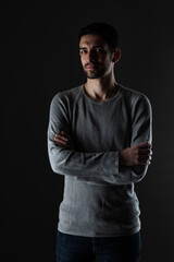 Naklejka premium Portrait of young handsome male with beard wearing blouse