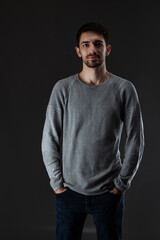 Obraz premium Portrait of young handsome male with beard wearing blouse