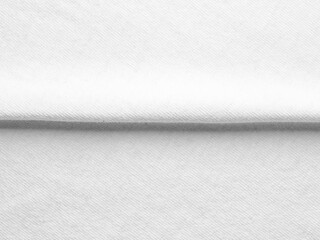 White fabric texture with a horizontal crease - exposed fibers - close up full frame view - high resolution photo