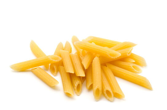 Macro Image of Penne Pasta Isolated on White Background