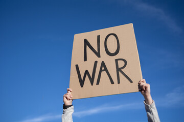 Stop war protest - People on street fighting for peace and human rights - Focus on banner sign