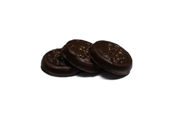 Cookies covered with chocolate and nuts, isolated on a white background.