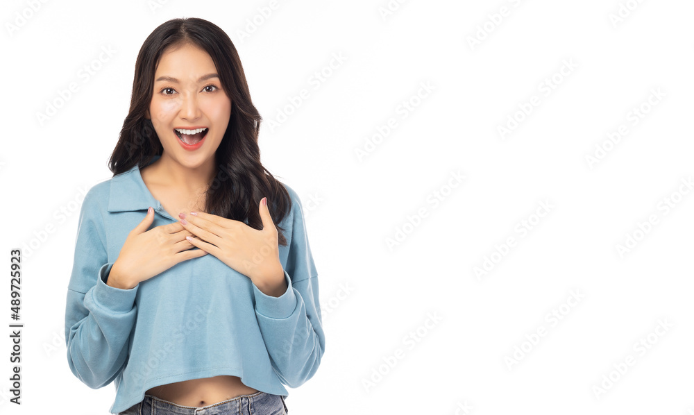 Wall mural Surprised happy beauty asian woman looking camera in excitement with happy and smile face Expressive facial expressions. Beautiful girl act like a satisfied product Isolated on yellow background