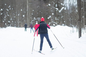 Fototapeta na wymiar Cross country Skilling. A skier goes skiing on the ski track.
