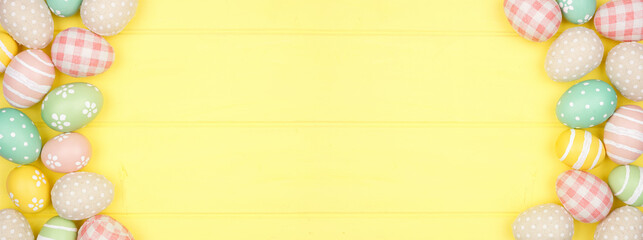 Easter double border with modern farmhouse cloth and pastel eggs over a yellow wood banner background. Top view with copy space.