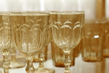 Glass crystal tableware on long legs, cups
