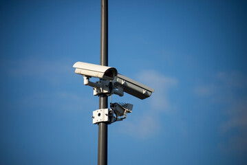 View of security camera on blue sky background