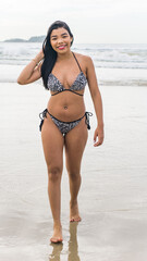 brazilian woman in bikini on the beach during summer