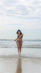 brazilian woman in bikini on the beach during summer