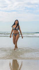 brazilian woman in bikini on the beach during summer