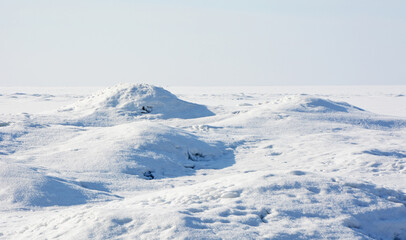 Ice hummocks on the coast of the Gulf of Finland in the spring (winter) season. Zelenogorsk, St. Petersburg, Russia.