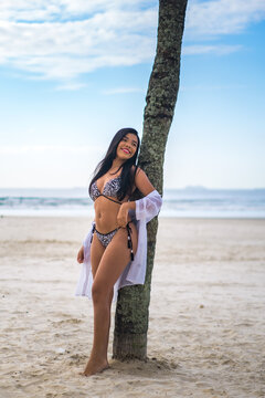 young beautiful and happy Asian Indonesian woman in bikini enjoying holidays at tropical beach in Bali enjoying holidays and travel