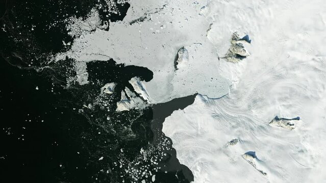 Melting glaciers time lapse, frozen Baffin Bay aerial satellite view from space. Animation based on image by Nasa