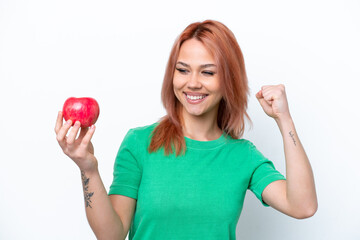 Young Russian girl with an apple isolated on white background celebrating a victory