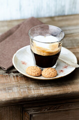 Coffee with milk on wooden background. Close up. 