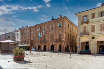 Fossano, Cuneo, Italy - February 27, 2022: the Town Hall building in via Roma between historic...
