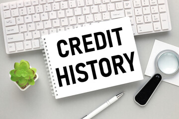 Credit History. text on notepad. open notepad on white keyboard