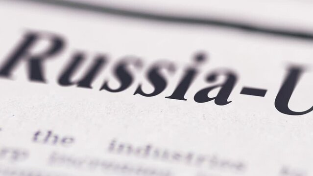 Footage of Russia and Ukraine written newspaper close up shot to the text.