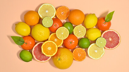 Summer citrus fruits arrangement on pastel beige and blue background. Flat lay food concept