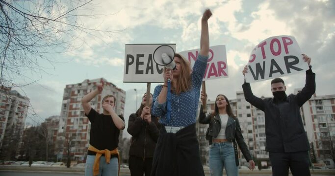 Stop the war, end the war protests with signs to act now and save the peace