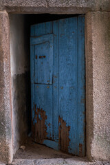 Old wooden door painted in blue.