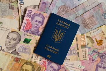 Biometric passport lies on Ukrainian money, the economy