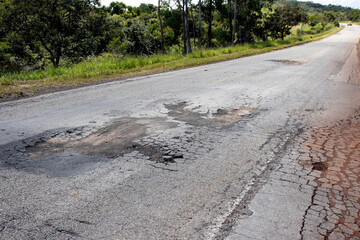 highway with damaged asphalt unsuitable for driving