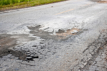 highway with damaged asphalt unsuitable for driving
