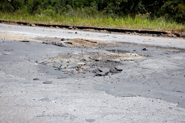 highway with damaged asphalt unsuitable for driving