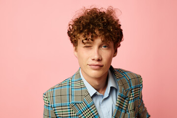 Obraz premium guy with red curly hair in a suit business look posing emotions Lifestyle unaltered
