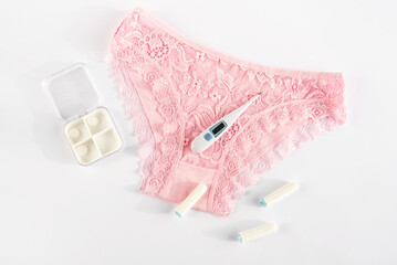 Woman underwear and intimate hygiene products. Concept of menstruation, woman's health, menstrual cycle, virginity, critical days, hygiene protection, pms, pain. Top view, flatly