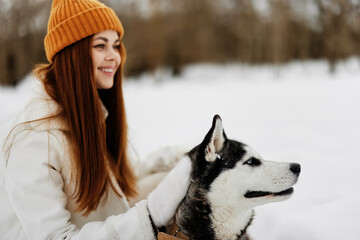 woman with dog outdoor games snow fun travel fresh air