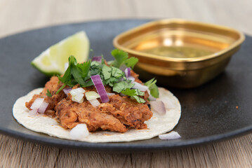 Eastern flavored chicken tikka taco served as an appetizer to eat before your meal