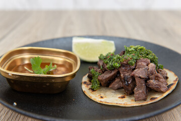 Tasty appetizer of a steak chimichuri taco to eat before your meal