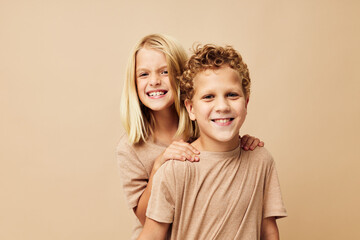 Cute stylish children gesticulate with their hands together Lifestyle unaltered