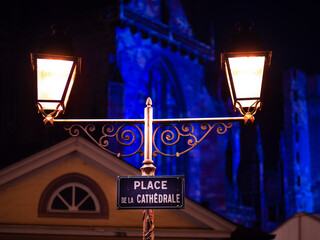 Place de la cathedrale - Cathedral Square at night in Colmar with a double street lamp. The...